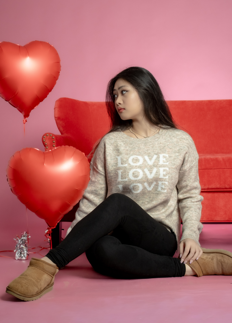 Oatmeal beige Valentine's Day sweater with white "LOVE" graphic, cozy relaxed fit