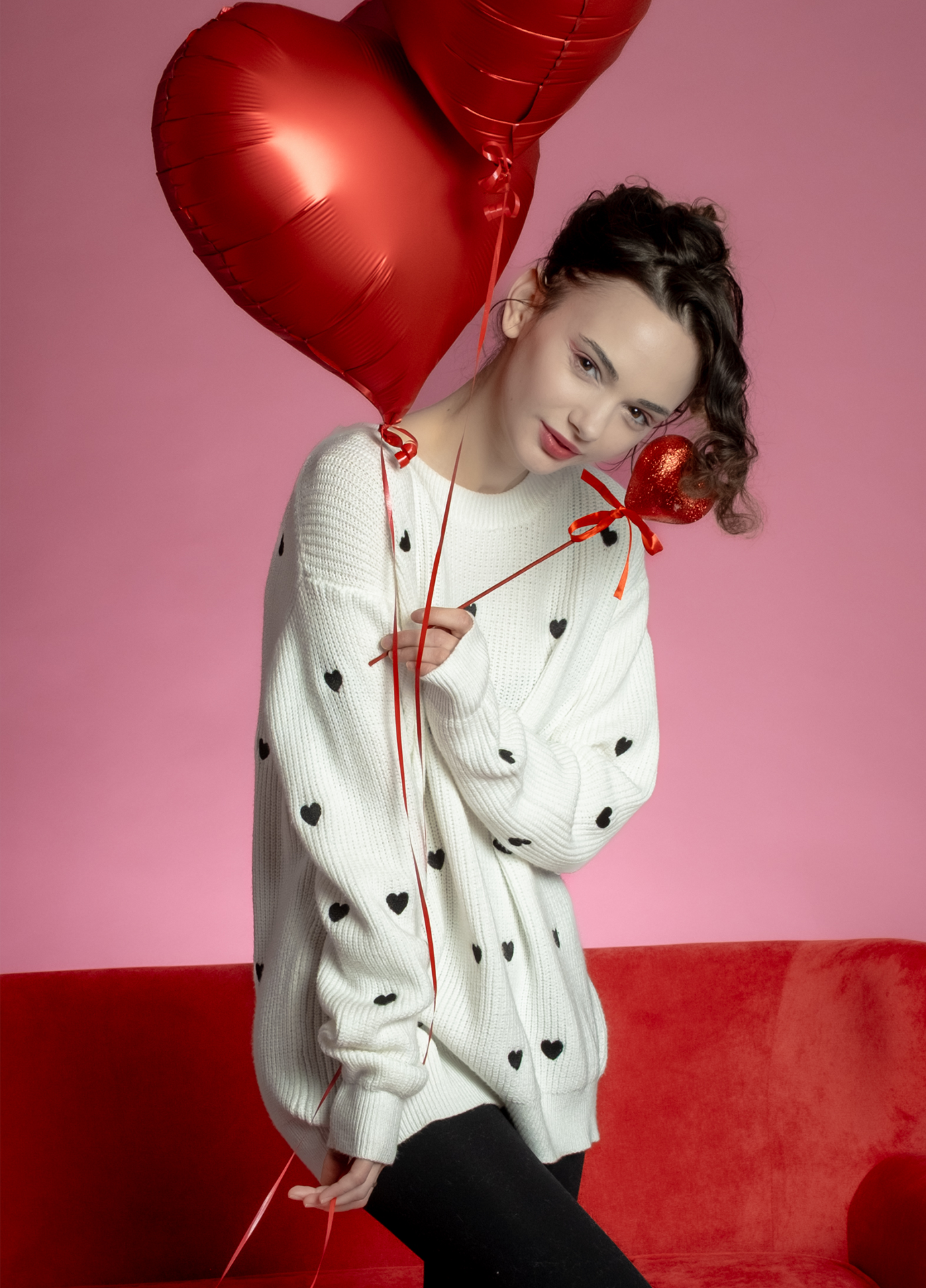 White Valentine’s Day sweater with black heart pattern
