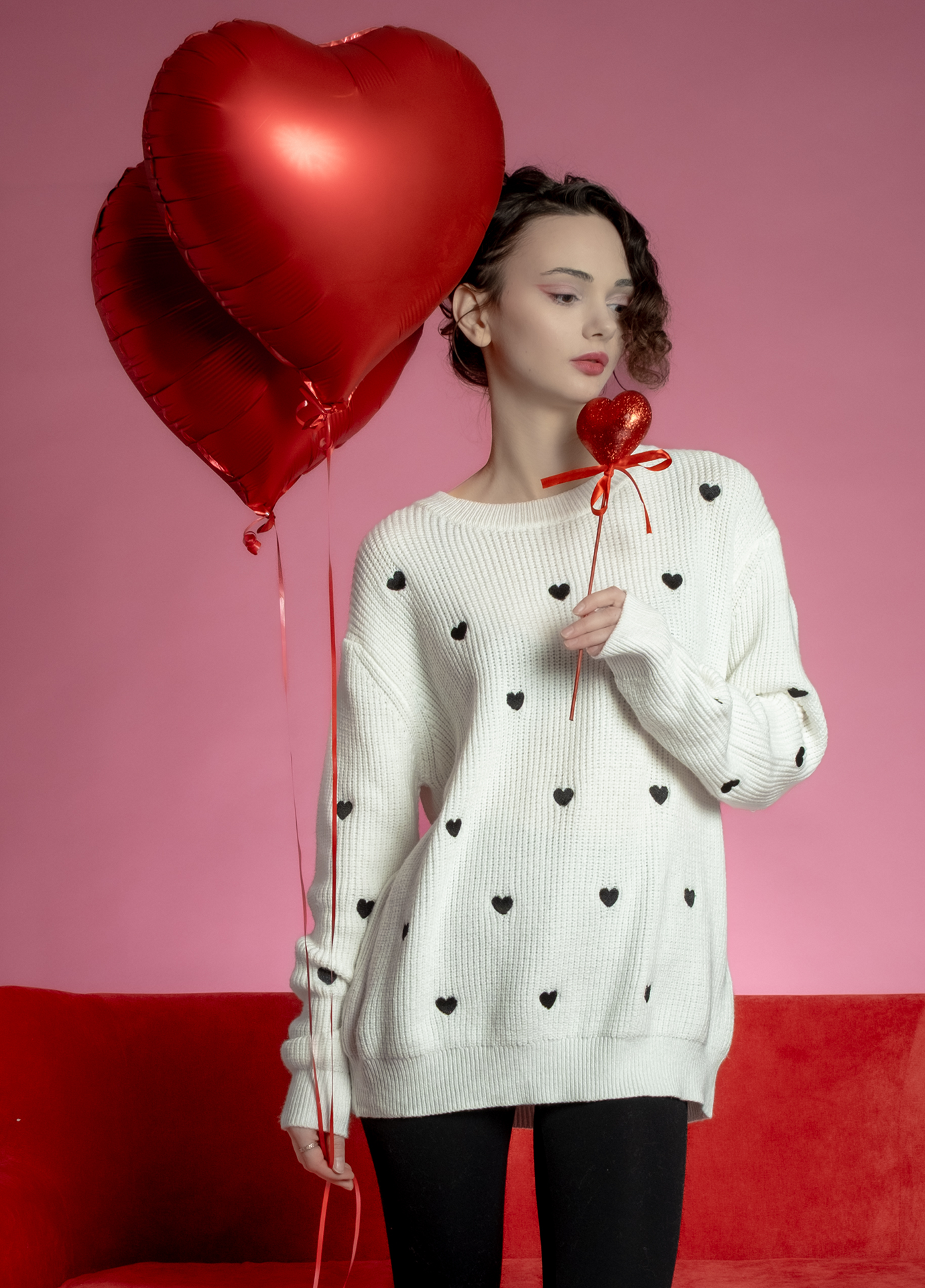White Valentine’s Day sweater with black heart pattern